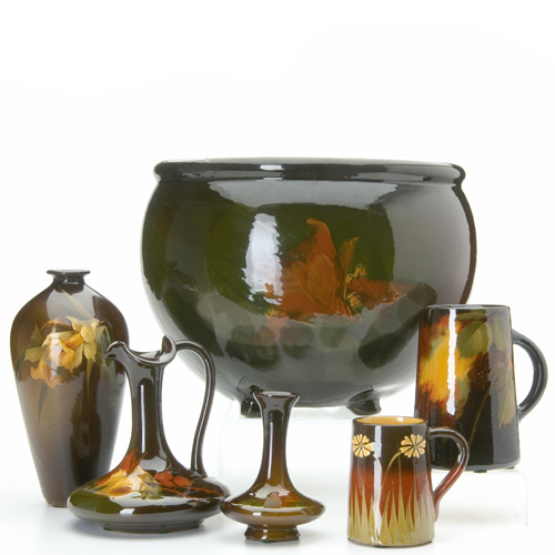 Appraisal: ZANESVILLE Six brown-glazed pieces a McCoy footed jardiniere painted with