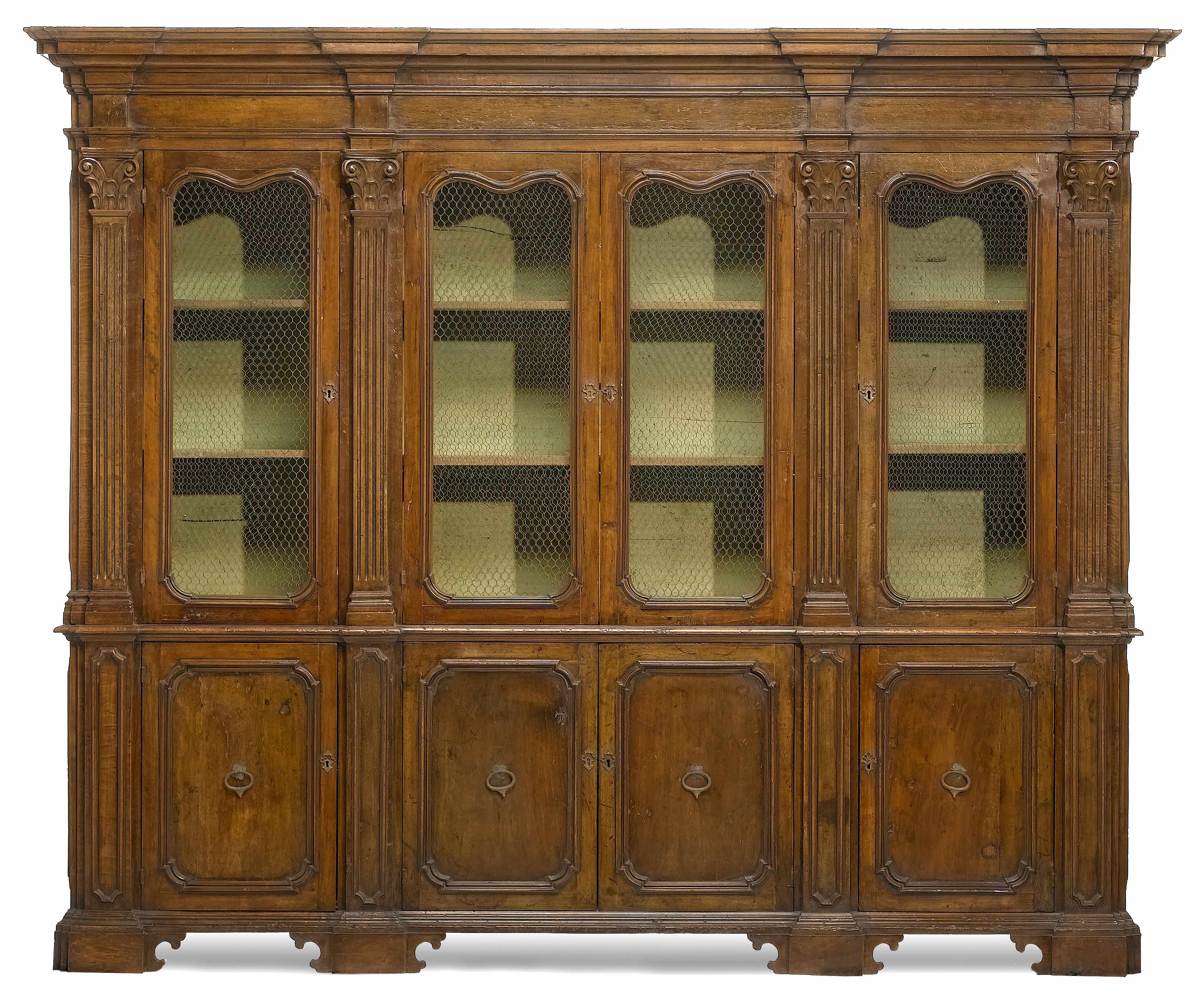 Appraisal: An Italian Baroque style walnut cabinet incorporating antique and later