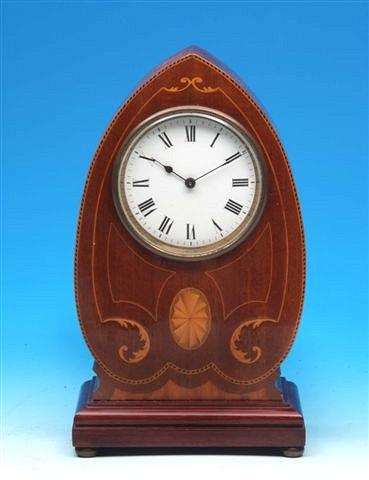 Appraisal: An Edwardian mahogany mantel timepiece the shaped case with decorative