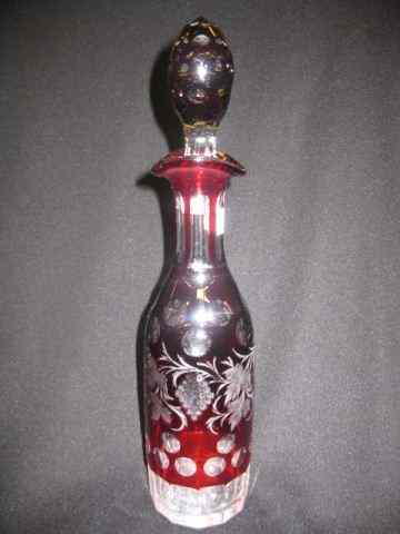 Appraisal: Bohemian Ruby Cut-to-Clear Decanter grape vine design coin spot trim