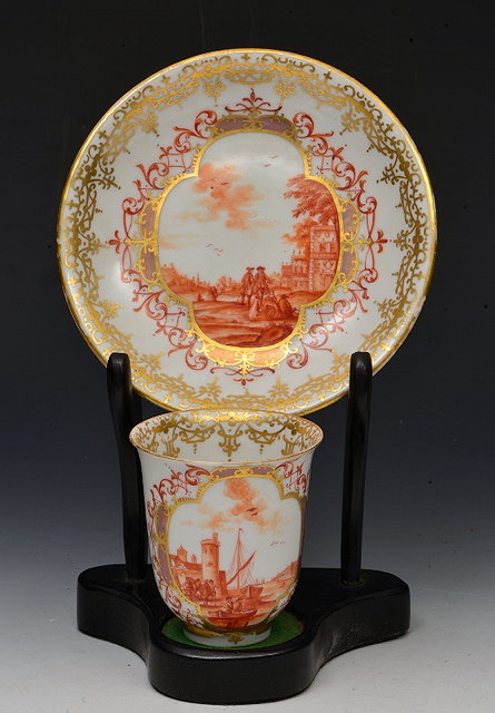 Appraisal: A CONTINENTAL BEAKER AND SAUCER possibly Meissen but unmarked painted