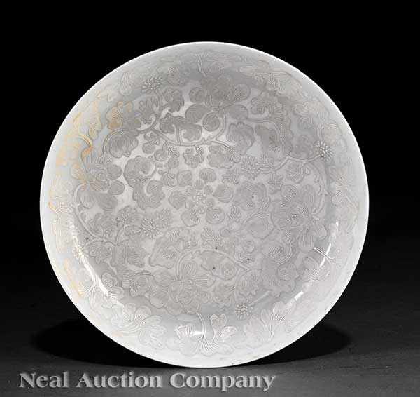 Appraisal: A Chinese White Slip Decorated Porcelain Dish th c thinly