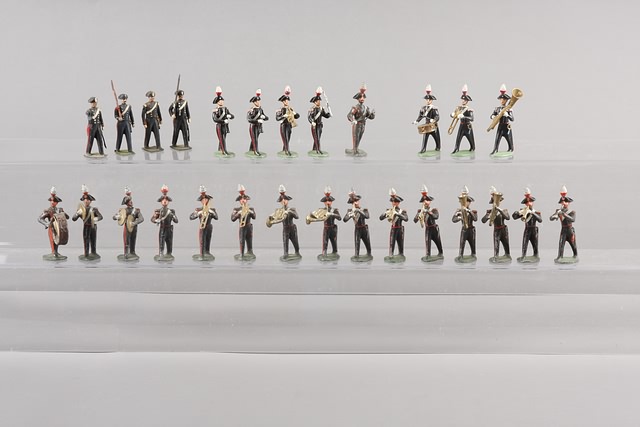 Appraisal: Lot of metal figures representing Italian Carabinieri Lot includes bandsman