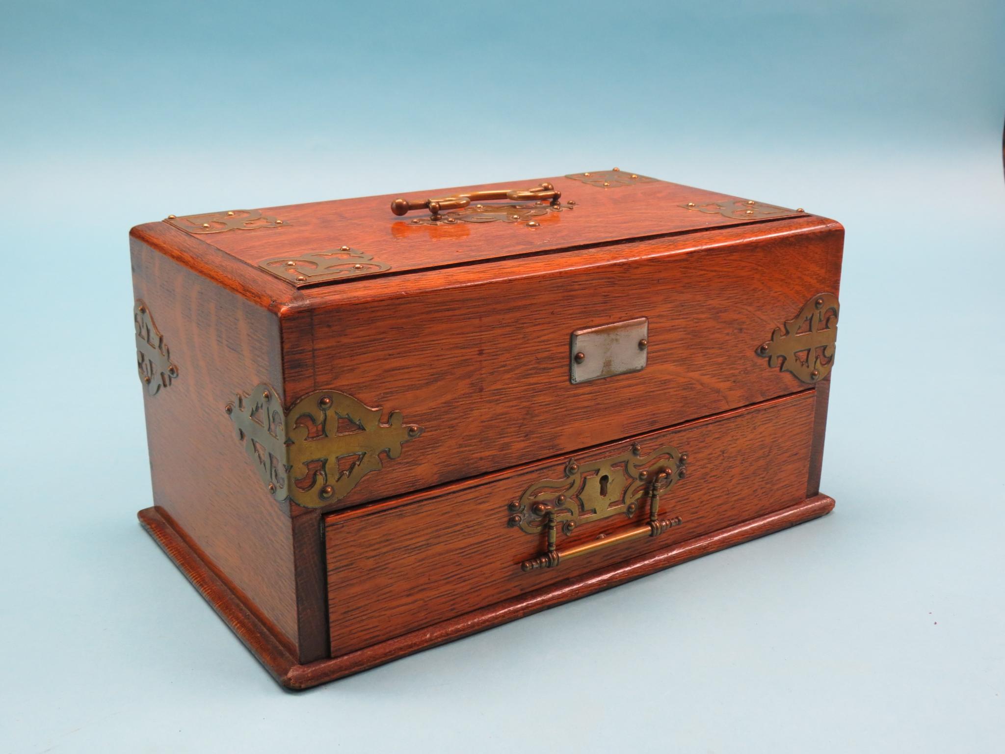 Appraisal: A Victorian oak stationery box simultaneous opening mechanism drawer with