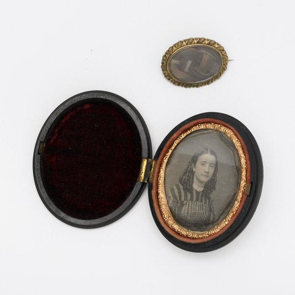 Appraisal: th C DAGUERREOTYPE AND HAIR JEWELRY Depicting a young woman