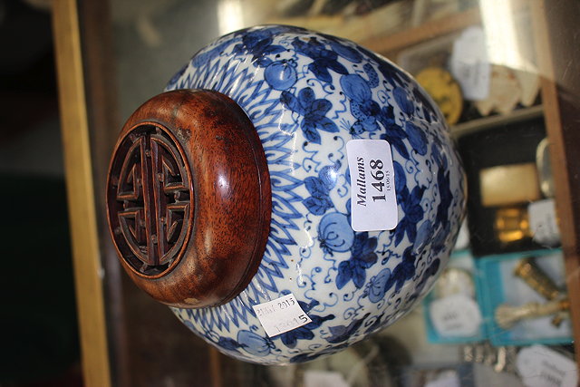 Appraisal: A BLUE AND WHITE GLAZED GINGER JAR of squat lobed