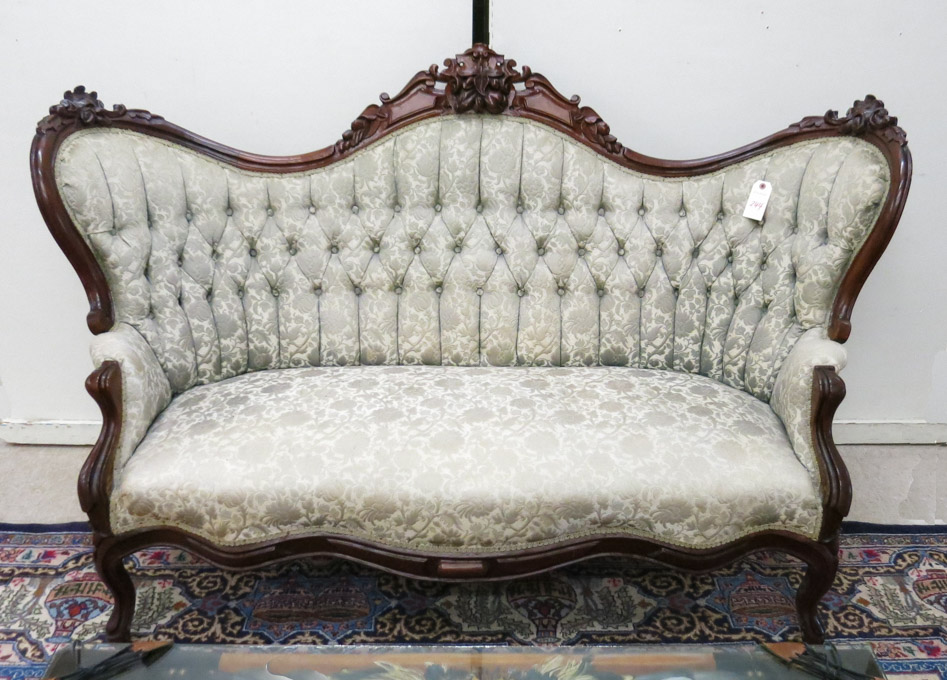 Appraisal: VICTORIAN SERPENTINE-BACK ENCLOSED-ARM SOFA Louis XV substyle American c having