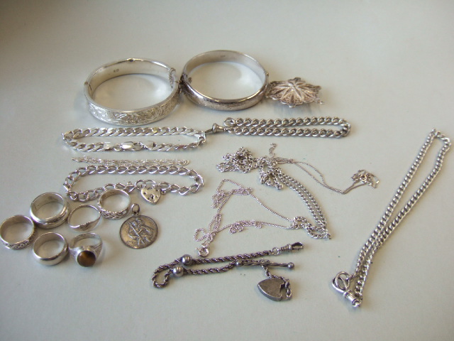 Appraisal: Mostly silver jewellery comprising four bracelets two bangles three neckchains