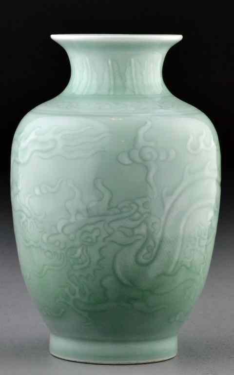 Appraisal: A Fine Chinese Celedon Glazed Porcelain VaseFinely molded to depict