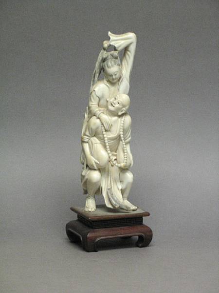 Appraisal: A Chinese carved ivory figural group Depicting a monk carrying