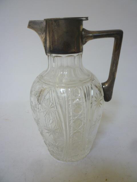 Appraisal: AN EDWARDIAN CLARET JUG maker Walker Hall Sheffield with plain