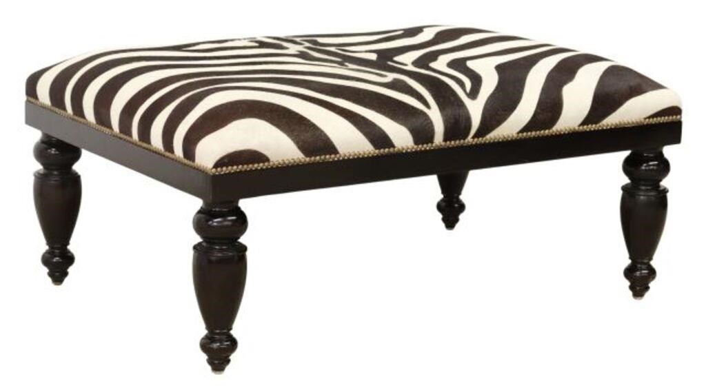 Appraisal: Contemporary ottoman footstool Oly Studio st c cowhide upholstery with