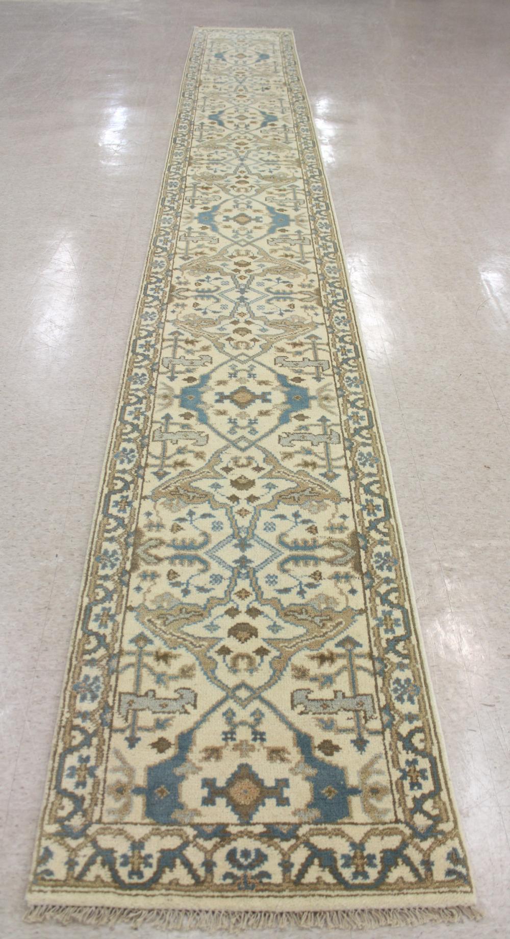 Appraisal: HAND KNOTTED ORIENTAL LONG RUG Oushak design on cream ground