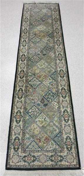 Appraisal: HAND KNOTTED ORIENTAL RUNNER Pakistani-Persian repeating floral panel design '