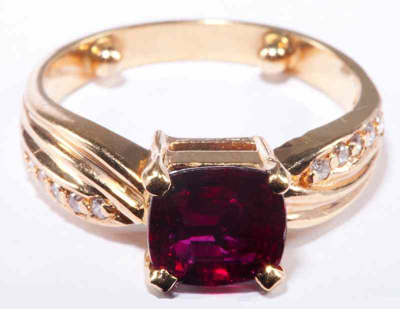 Appraisal: Ruby and Diamond Ringcentering on one round brilliant step cut