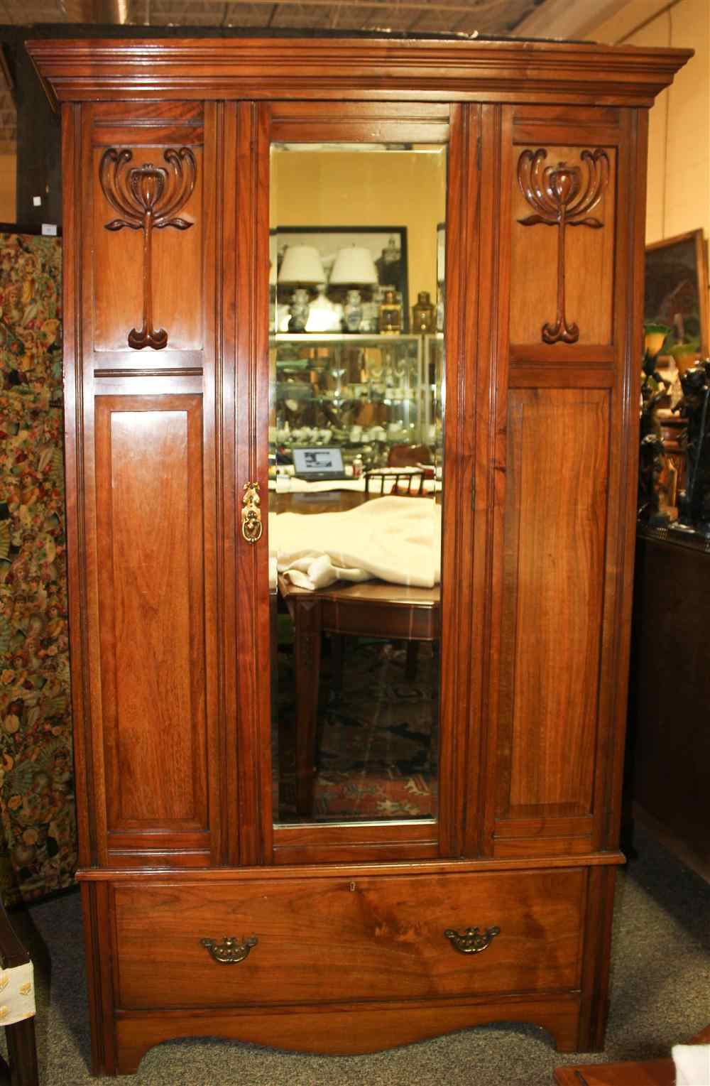 Appraisal: ART NOUVEAU CHERRYWOOD ARMOIRE having a molded top over a