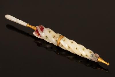 Appraisal: A mother-of-pearl needle case in the form of an umbrella