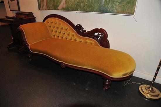 Appraisal: A VICTORIAN BUTTON BACKED CHAISE LOUNGE IN MUSTARD TONES