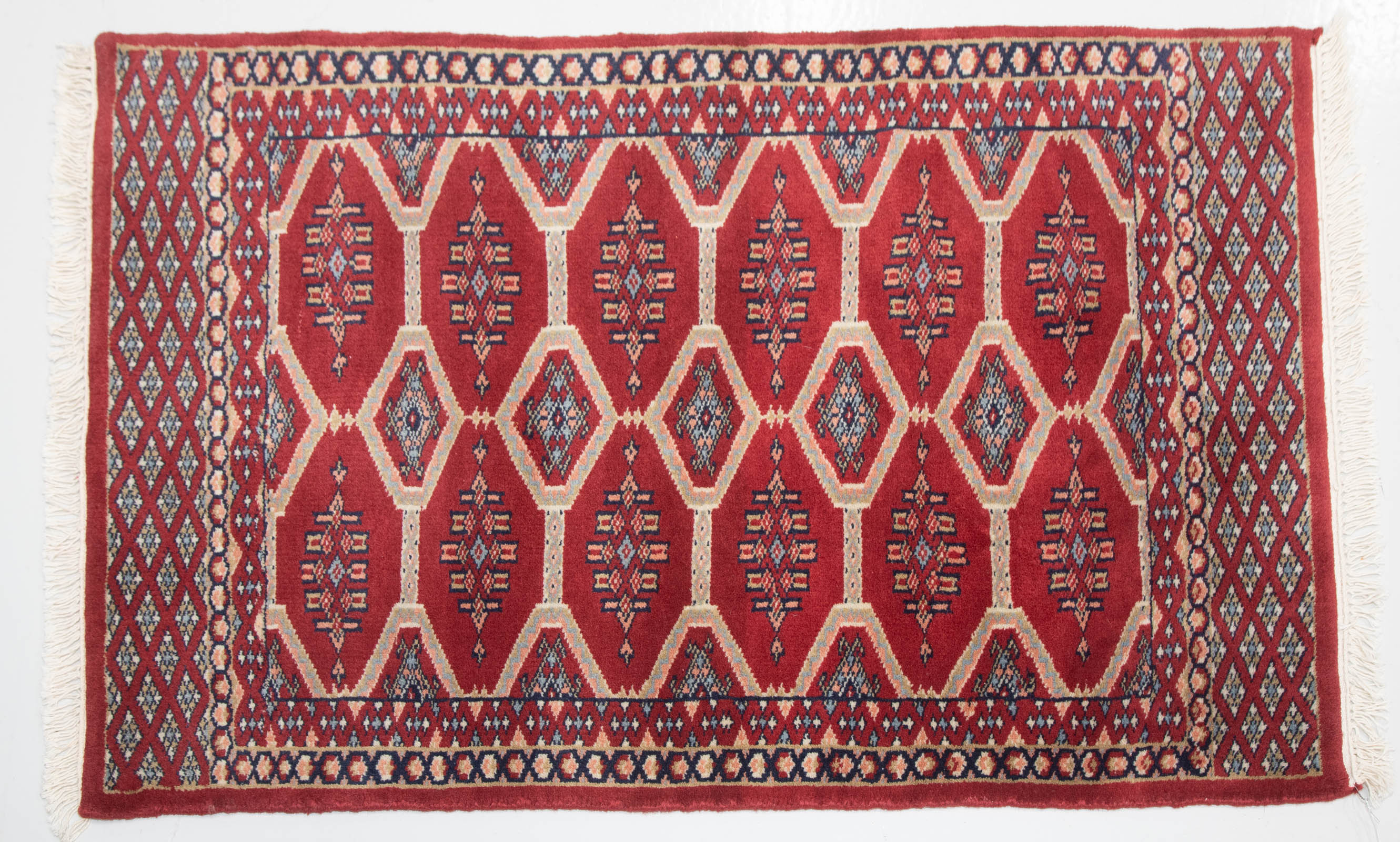 Appraisal: BOKHARA RUG PAKISTAN X Modern hand-knotted wool pile