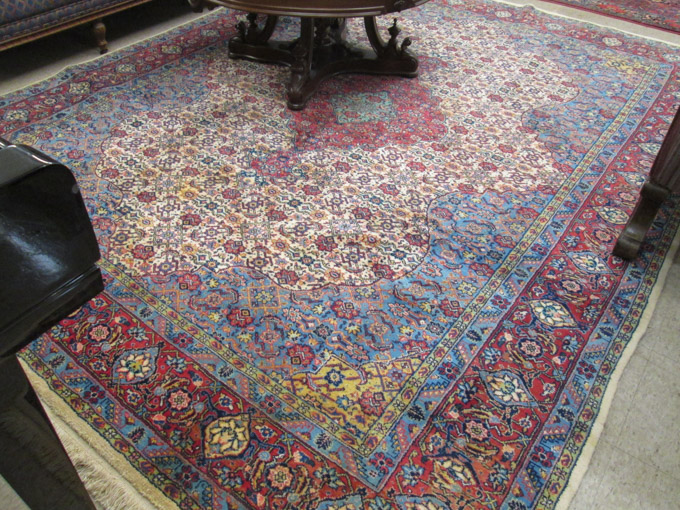 Appraisal: HAND KNOTTED PERSIAN CARPET central medallion and overall Herati floral