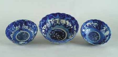 Appraisal: THREE BLUE AND WHITE IMARI BOWLS Each with shaped rim