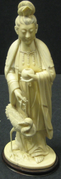 Appraisal: CHINESE CARVED IVORY FIGURE OF A BEAUTY Standing and holding