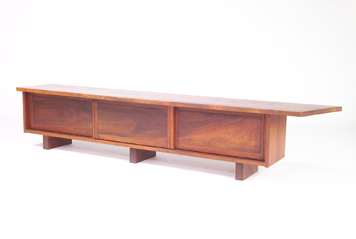 Appraisal: GEORGE NAKASHIMA Unusual walnut bookcase bench with overhanging free-edge top