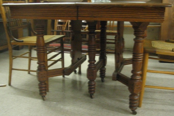 Appraisal: LATE VICTORIAN SQUARE ASHWOOD DINING TABLE WITH THREE LEAVES American