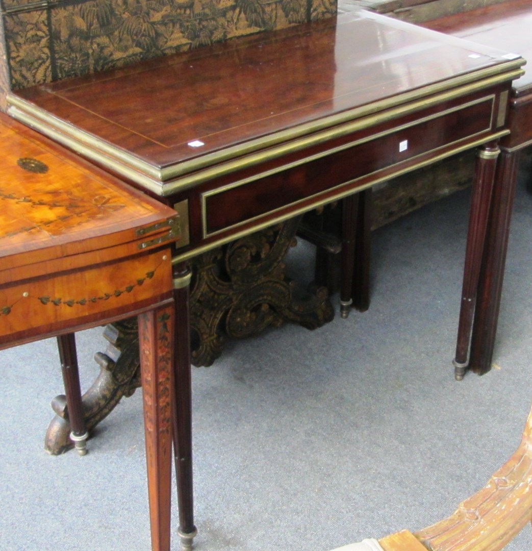 Appraisal: A th century French brass mounted mahogany tea table on