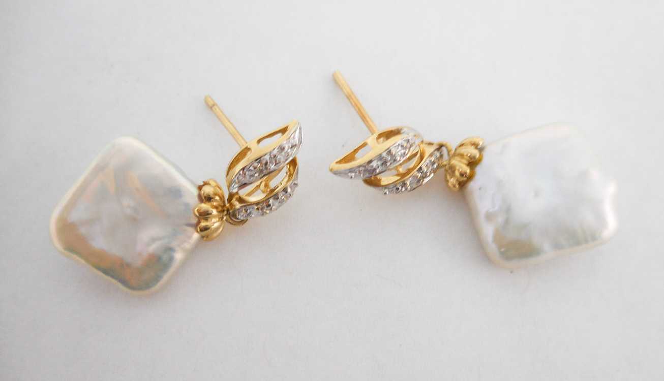 Appraisal: PAIR OF PEARL AND DIAMOND EARRINGS each k yellow and