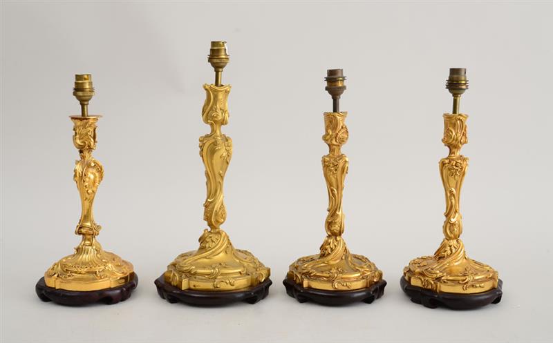 Appraisal: SET OF THREE SIMILAR LOUIS XV STYLE GILT-BRONZE CANDLESTICKS AND