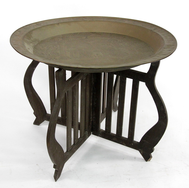 Appraisal: A large brass table top decorated an elephant by a