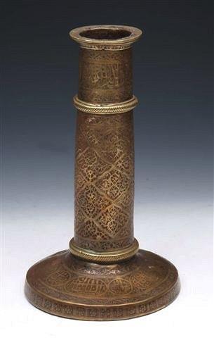 Appraisal: A TH CENTURY PERSIAN NIELLOED BRASS CANDLESTICK of cylindrical form