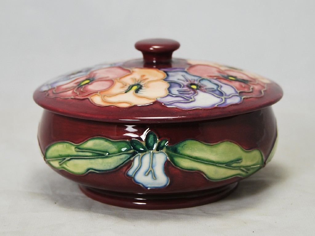 Appraisal: Contemporary Moorcroft bowl and cover pansy pattern on purple ground