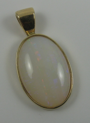 Appraisal: OPAL AND FOURTEEN KARAT GOLD PENDANT set with an oval