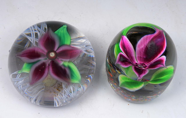 Appraisal: A HEAVY GLASS PAPERWEIGHT inset Clematis flower cm diameter and