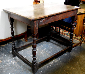 Appraisal: A th century oak table the two plank top with