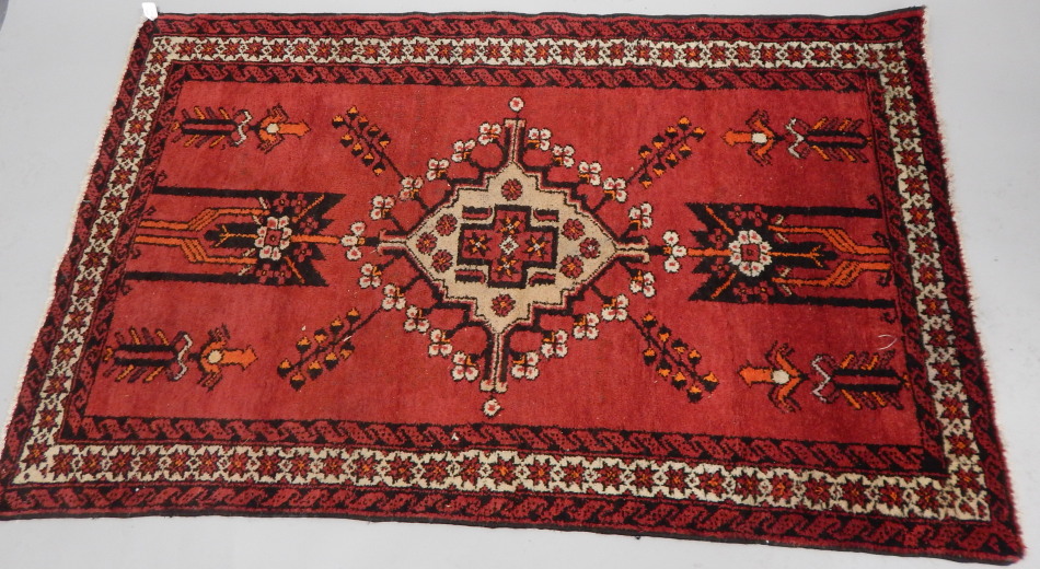 Appraisal: A Persian style rug in geometric floral pattern predominately in