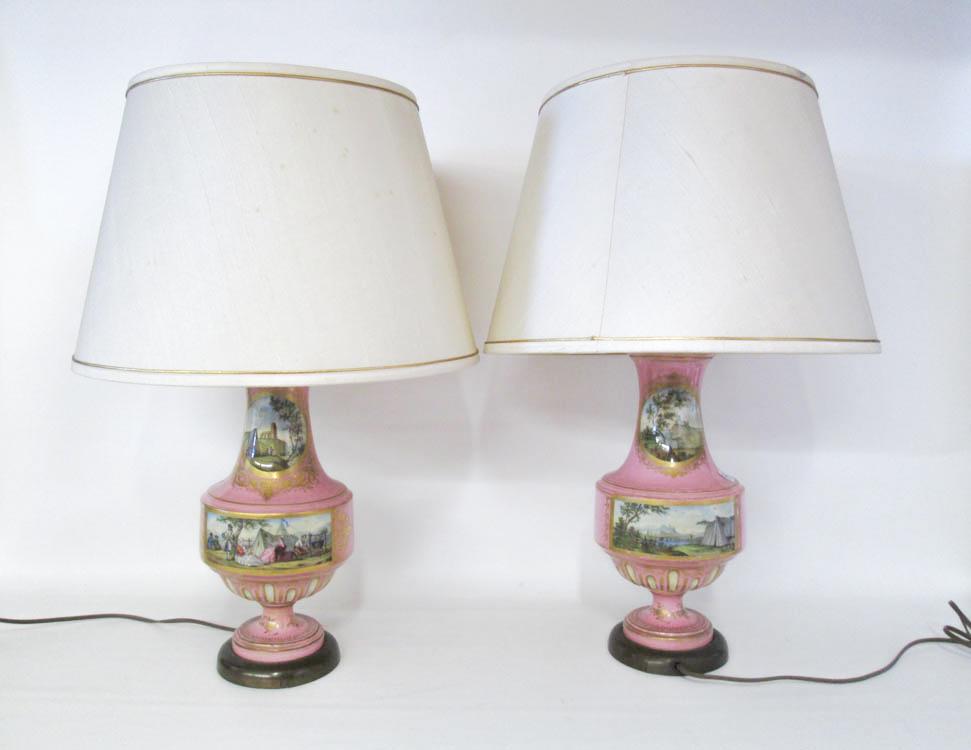 Appraisal: PAIR OF PINK PORCELAIN TABLE LAMPS with hand painted reserves