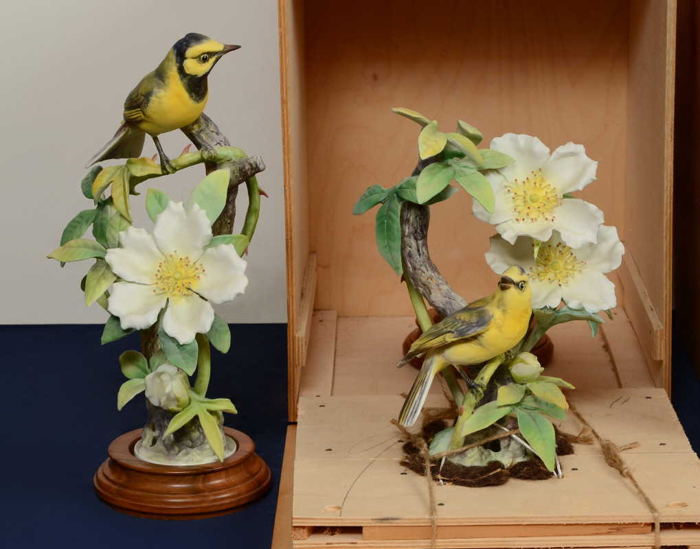 Appraisal: PAIR OF DOROTHY DOUGHTY PORCELAIN BIRD FIGURES Hooded Warbler hen