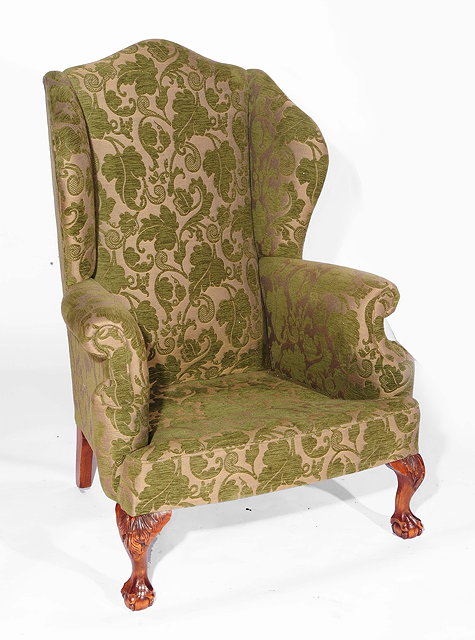 Appraisal: A Wesley Barrell wingback armchairwith green patterned th Century style