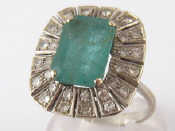 Appraisal: A white metal tests carat gold emerald and diamond ring