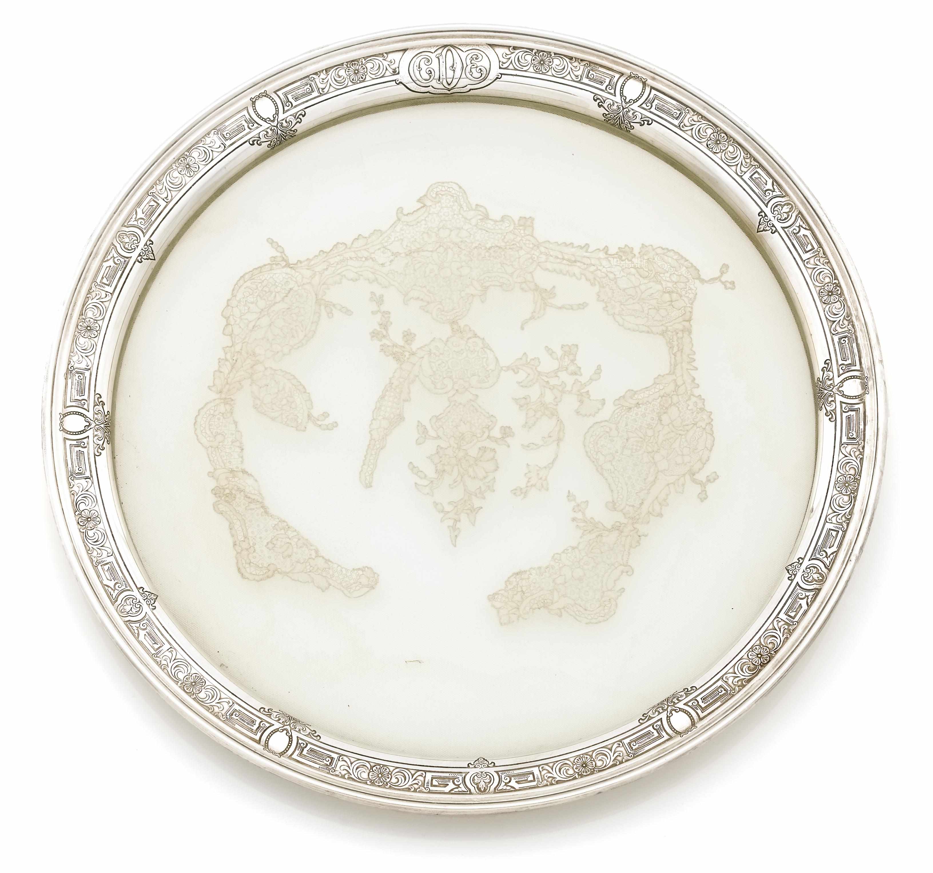 Appraisal: A custom glass base circular tray with lace inset and