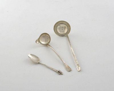 Appraisal: By Anthony Hawksley a silver cream ladle with textured decoration