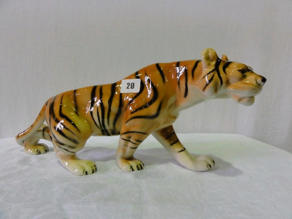 Appraisal: A Royal Dux model of a prowling tiger with raised