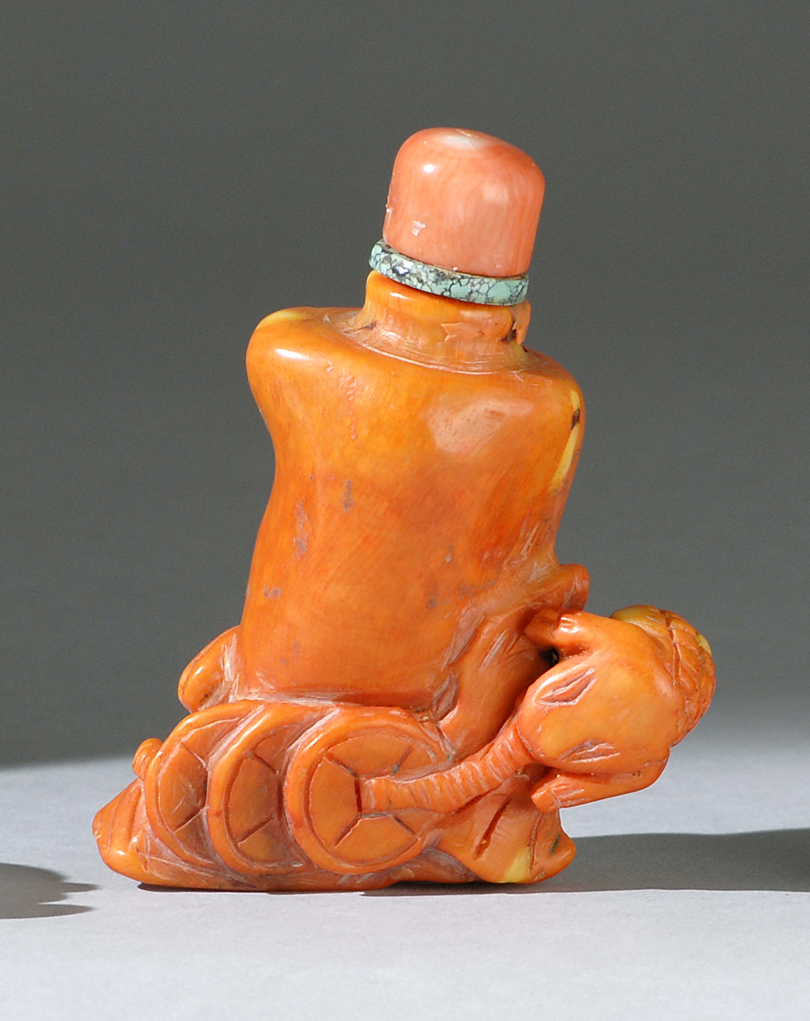 Appraisal: CORAL SNUFF BOTTLE th CenturyIn tree stump form with elephant-like