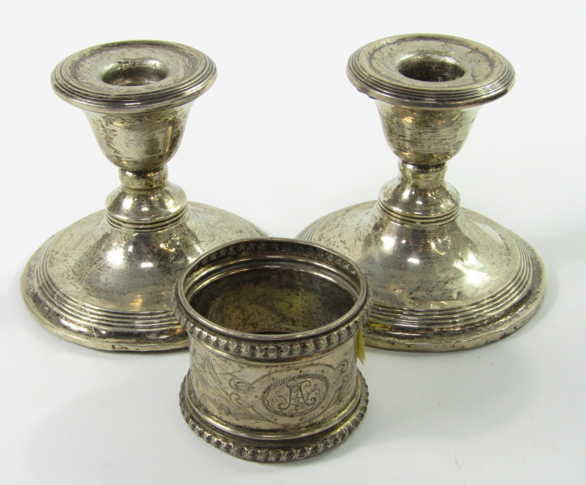 Appraisal: A pair of George V silver dwarf candlesticks with reeded