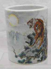 Appraisal: A Chinese ceramic brush pot decorated with a tiger amidst