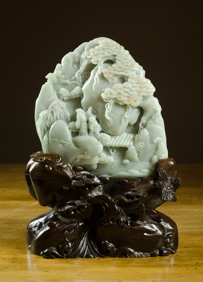 Appraisal: CHINESE CARVED GREEN JADEITE SCULPTURE ON CARVED WOOD STAND a