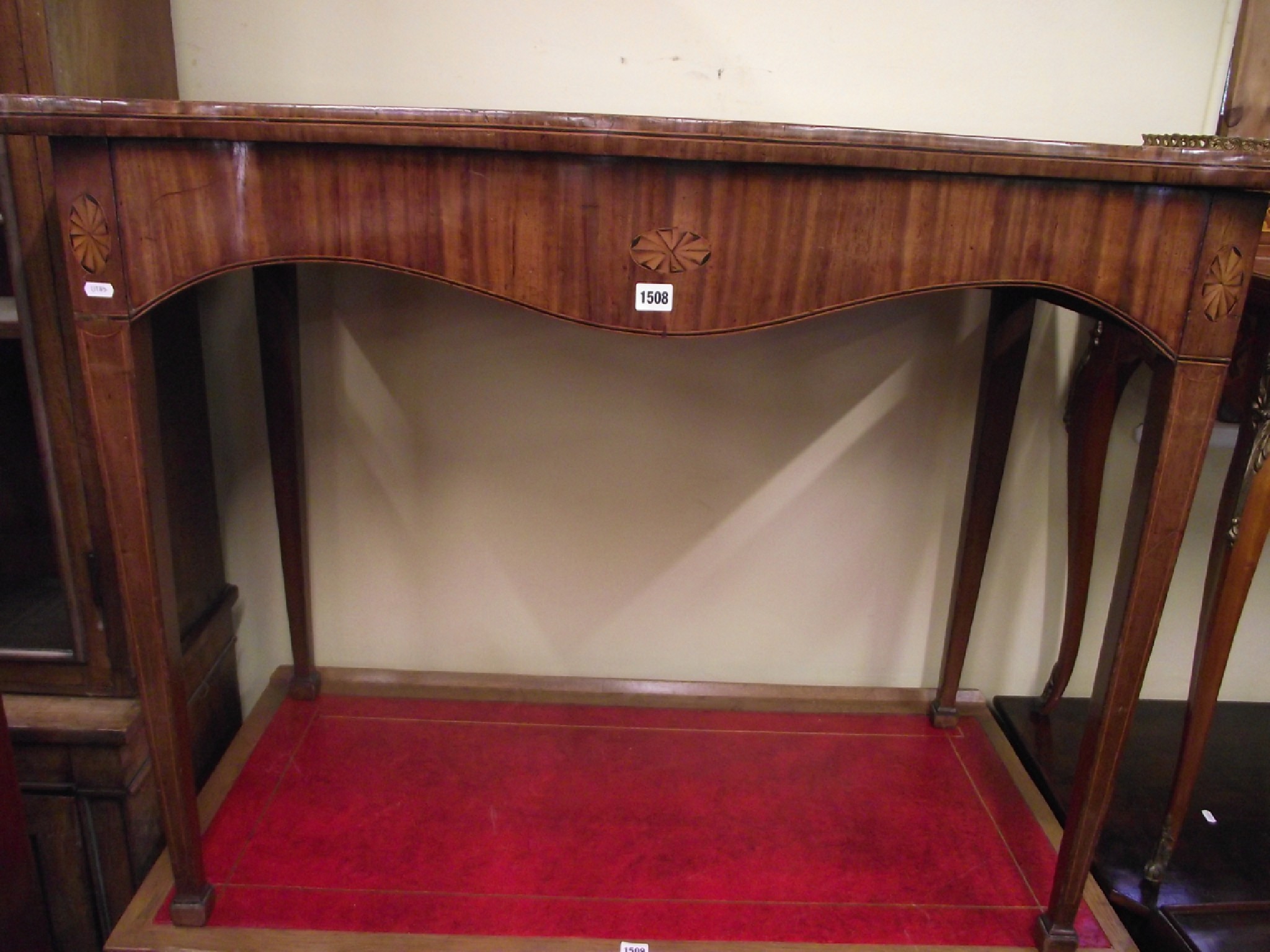 Appraisal: A Georgian mahogany serpentine side or serving table with further